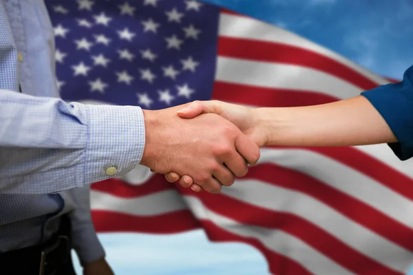 Male and female colleagues shaking hands — Stock Photo, Image