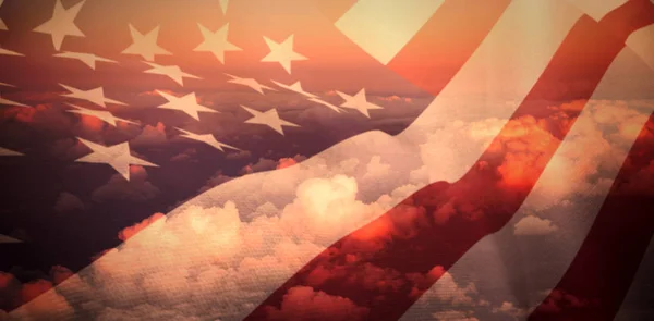 Us flag against cloudy sky — Stock Photo, Image