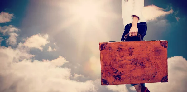 Woman carrying vintage suitcase — Stock Photo, Image