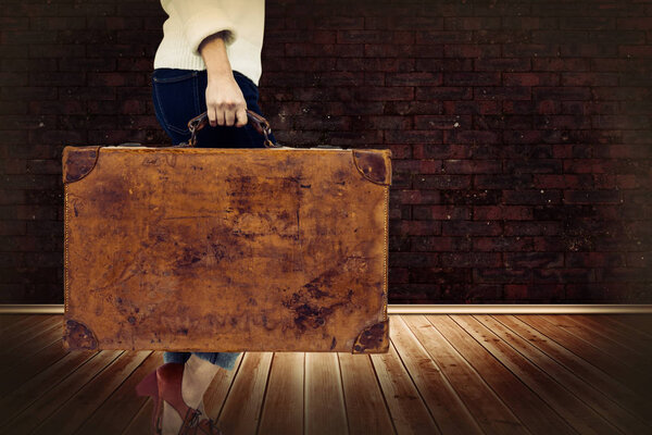 woman holding vintage suitcase 