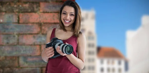 Young photographer holding camera — Stock Photo, Image