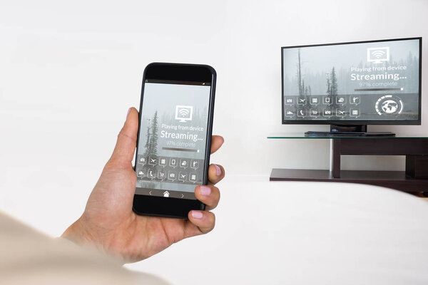 Composite image of businesswoman using mobile phone