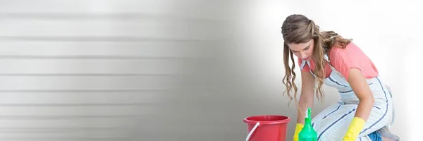 Limpador com balde com fundo brilhante — Fotografia de Stock
