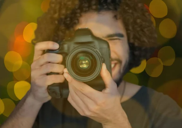 Young photographer taking a photo — Stock Photo, Image