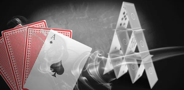 Spelkort med grå rök mot grunge bakgrund — Stockfoto