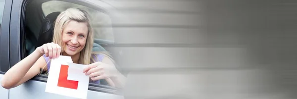 Woman In car holding L sign ripping with transition — Stock Photo, Image