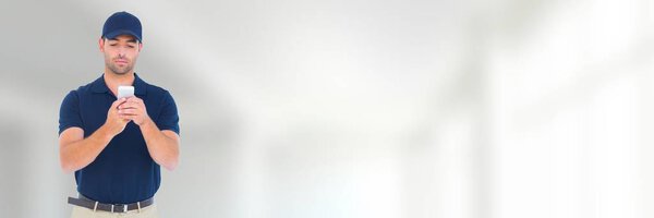 Man on phone with cap in front of blurred background and copy space 