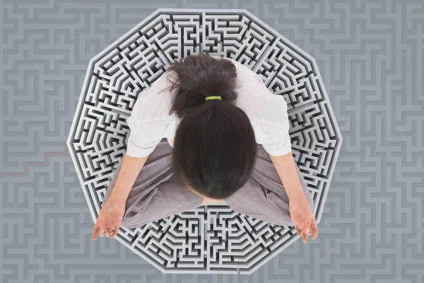 Woman meditating on a 3D maze