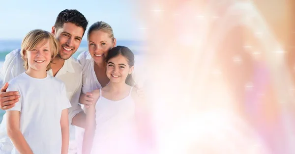 Family at beach with peach transition — Stock Photo, Image