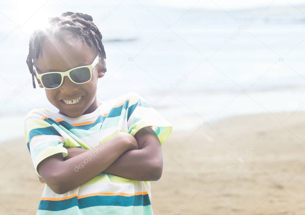 Boy in sunglasses arms folded 