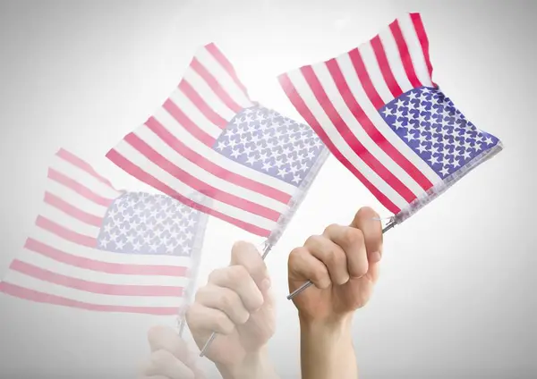 Mano agitando banderas americanas — Foto de Stock