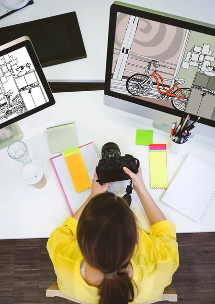 Photographer working on the computers on new designs — Stock Photo, Image