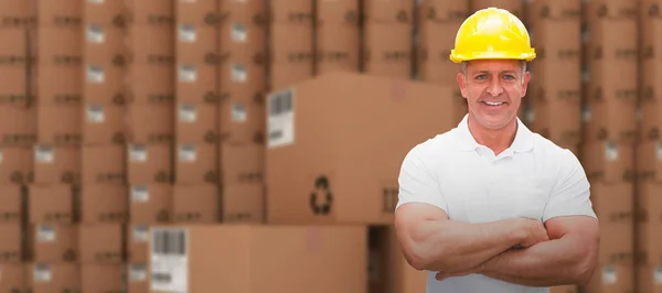 Worker wearing hard hat in warehouse — Stock Photo, Image