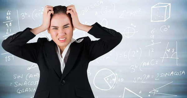 Mulher de negócios frustrada contra gráficos matemáticos — Fotografia de Stock