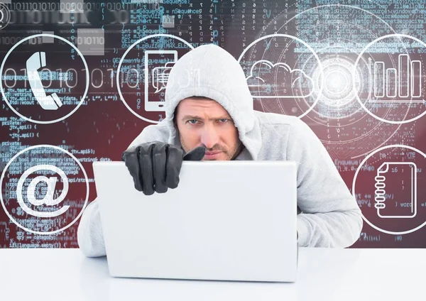 Hacker com luvas usando um laptop — Fotografia de Stock