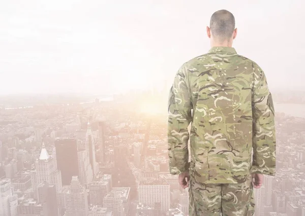 Rear view of military standing against city — Stock Photo, Image