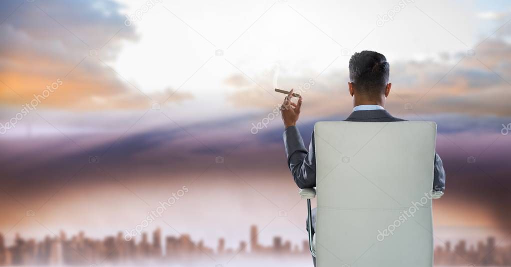 businessman in chair in city sky