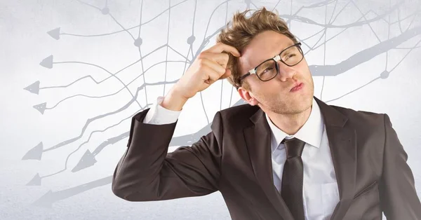 Frustrated business man against white wall and graph — Stock Photo, Image