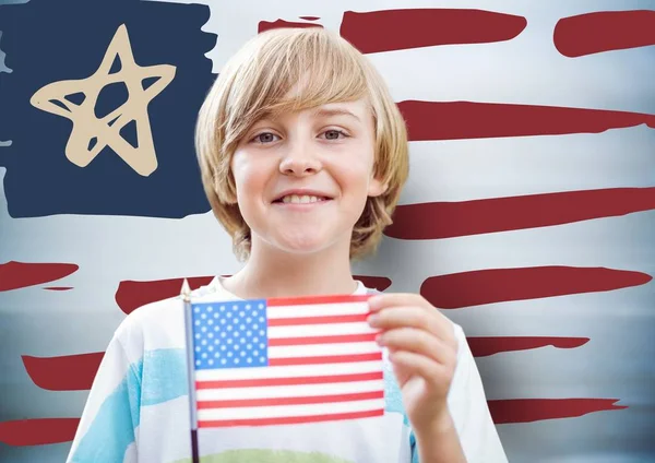 Niño sosteniendo bandera americana — Foto de Stock