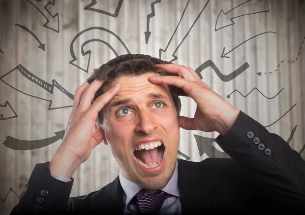 Hombre de negocios frustrado contra gráficos de flecha 3D —  Fotos de Stock