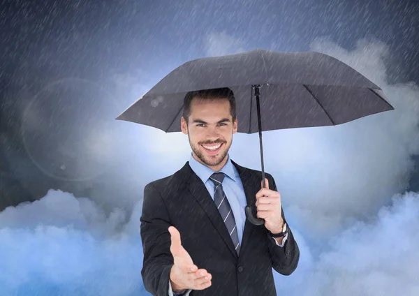 Man biedt zijn hand met een paraplu — Stockfoto