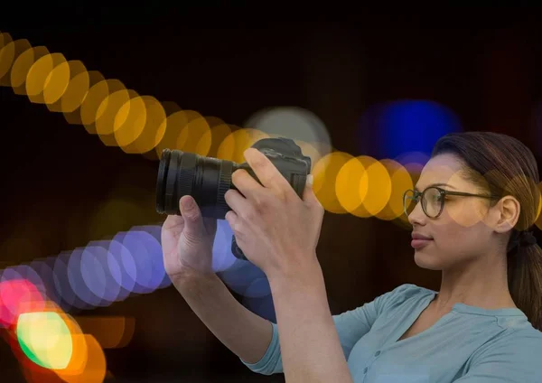 Photographer in front of lights bokeh — Stock Photo, Image