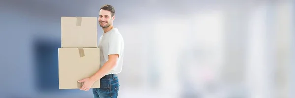 Homem com caixas na frente de fundo desfocado 3d — Fotografia de Stock