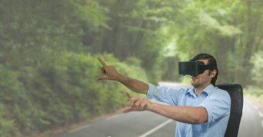 Man in VR headset raising hands against road background clipart