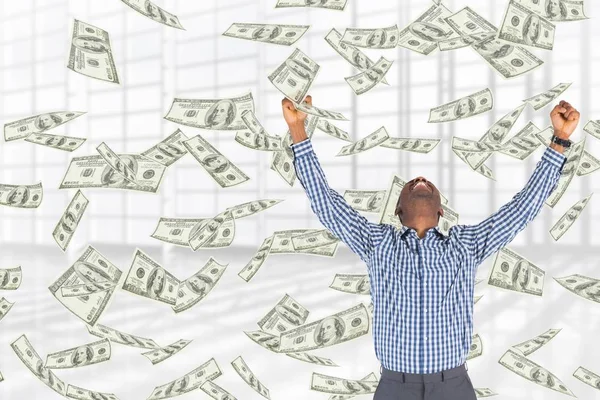 Hombre de negocios emocionado con lluvia de dinero sobre fondo blanco — Foto de Stock