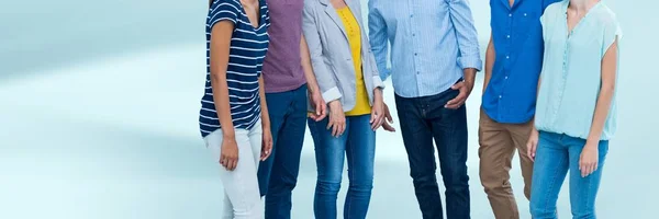 Group of People standing with blurred blue background — Stock Photo, Image