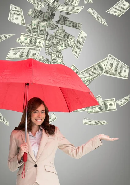 Mujer de negocios feliz bajo paraguas con lluvia de dinero sobre fondo gris — Foto de Stock