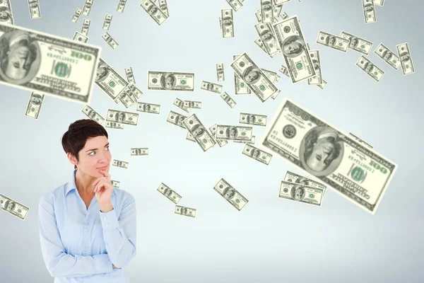 Business woman looking at money rain against white background — Stock Photo, Image