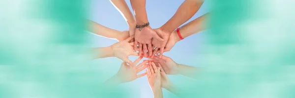 Low angle of hands together and blurry  teal framing — Stock Photo, Image