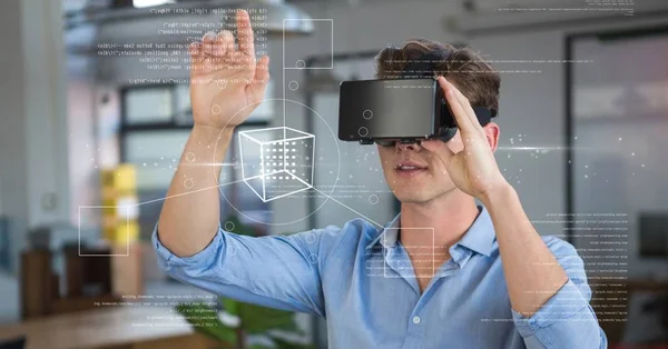 Man in VR headset touching interface — Stock Photo, Image