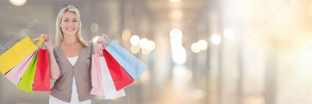 Woman shopping with bags and blurred lights transition