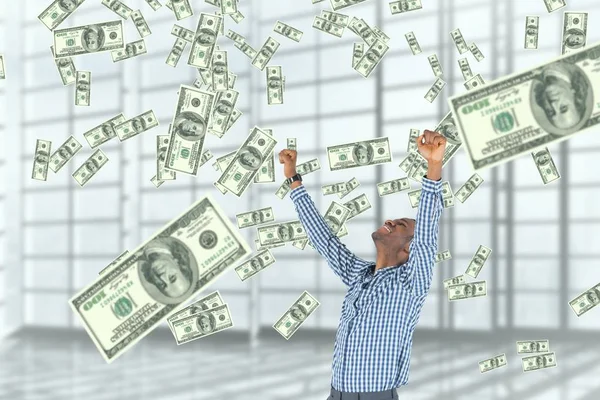 Excited business man looking at money rain against white background — Stock Photo, Image