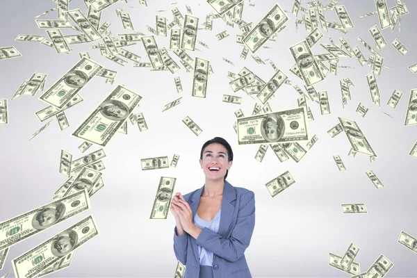 Mujer de negocios feliz mirando el dinero lluvia sobre fondo blanco — Foto de Stock