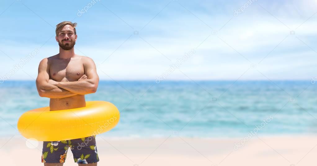 Happy man standing with float
