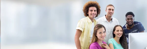 Students standing with computer — Stock Photo, Image