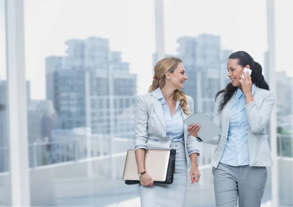 Happy business women holding devices — Stock Photo, Image