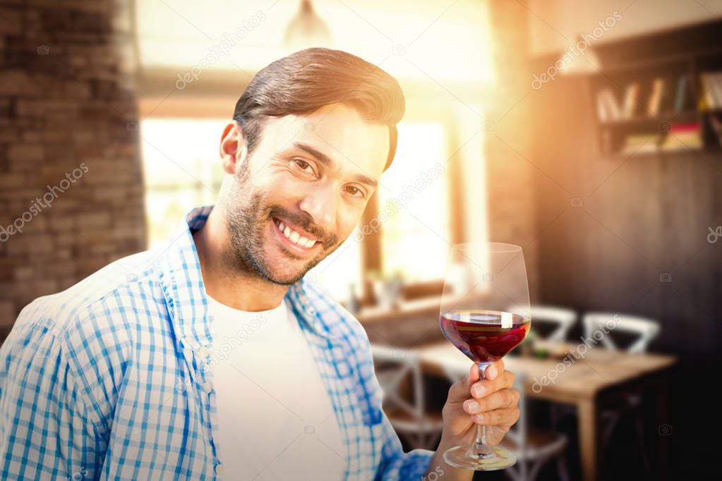 smiling man with red wine