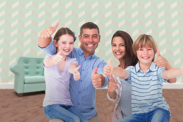 Šťastné rodiny směřují palec nahoru — Stock fotografie