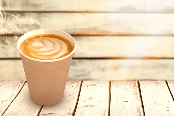 Taza de café contra fondo de madera — Foto de Stock