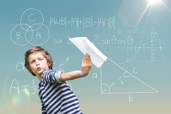 Boy holding paper airplane — Stock Photo, Image