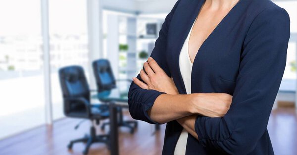 Business woman standing with office background