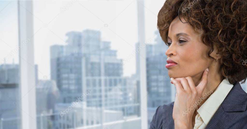 Businesswoman thinking against city 