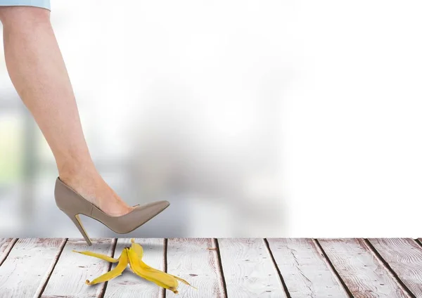 female foot stepping on banana