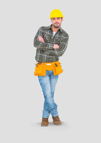 Builder standing with grey background — Stock Photo, Image