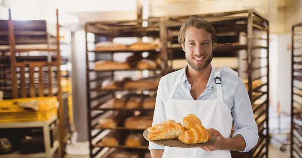 Kleinunternehmer mit Croissants — Stockfoto