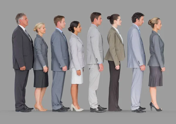 Business people standing in line Stock Image